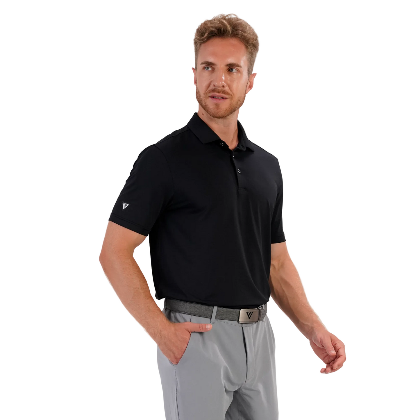 Man wearing a Levelwear black polo shirt and gray pants on a white background