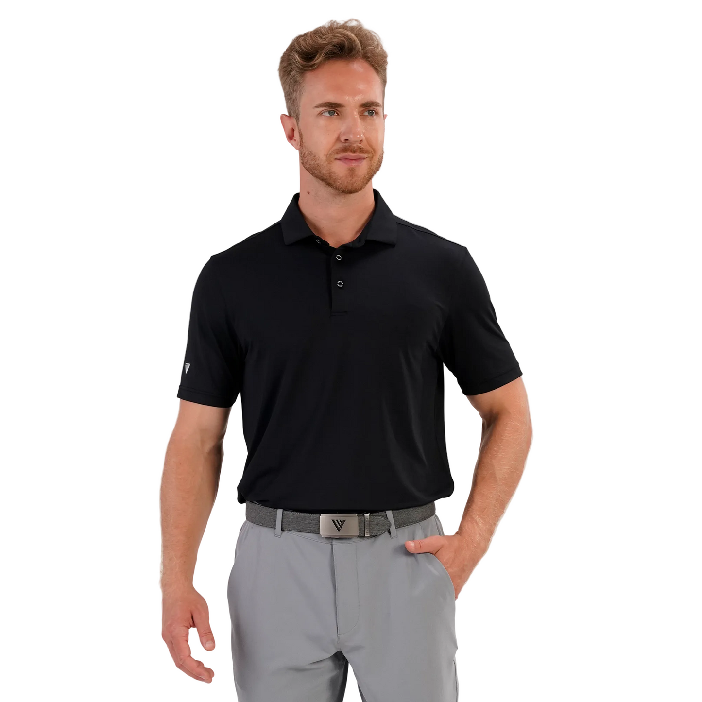 Man wearing a levelwear black polo shirt and gray pants on a white background